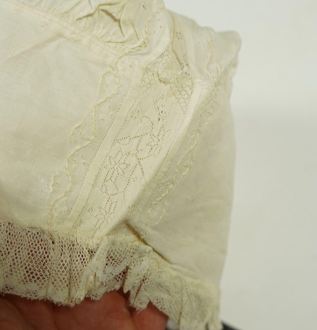 A collection of six baby’s bonnets from the mid 18th century to the late 19th century. An 18th century Hollie Point inserted baby bonnet, a quilted 18th century baby bonnet, two white work bonnets with needle lace crown